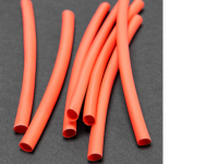 термозбіжні трубки на сірому фоні