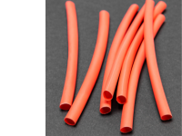 помаранчеві силіконові термоусадки на сірому фоні