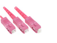 фото розовых разъёмов SC на белом фоне